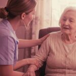 Woman with mobility getting help out of chair