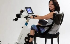 Patient in recovery using active-passive ergometer cycle